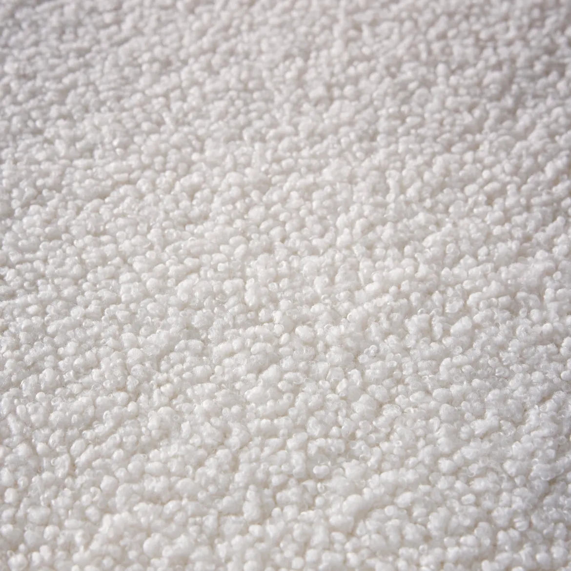 Poltrona letto bouclé con base in legno