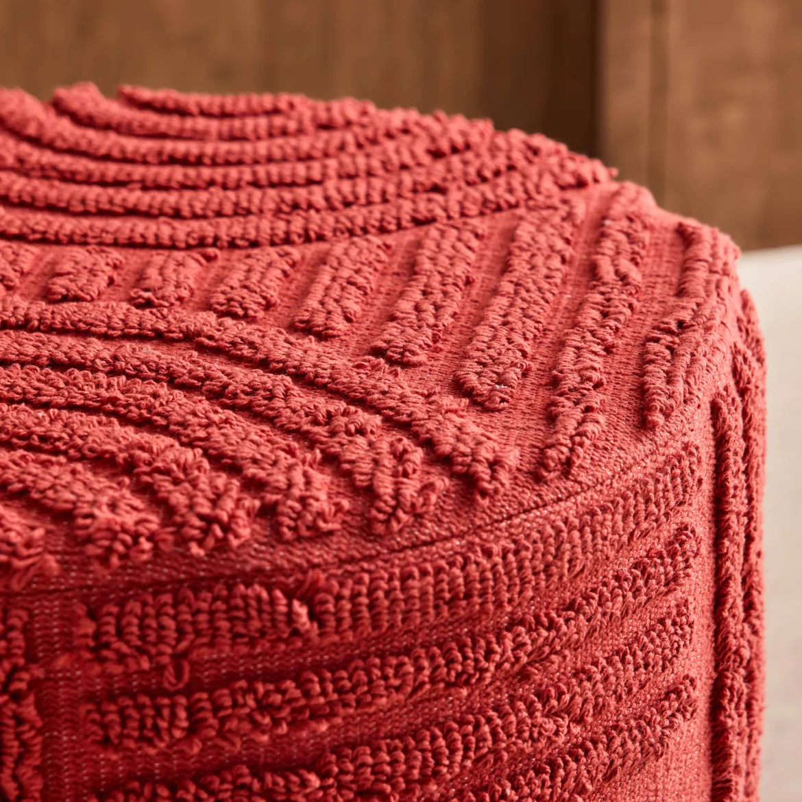 Pouf rotondo in bouclé testurizzato