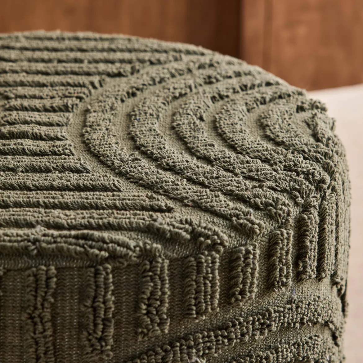 Pouf rotondo in bouclé testurizzato