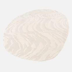 Tappeto interno a forma di ciottolo con rilievo crema